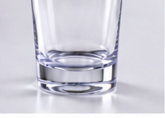 Close view of a clear tumbler surface and base